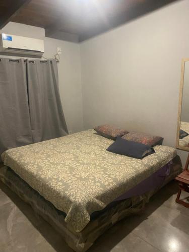 a bedroom with a bed in a room at Casa roja in Eldorado