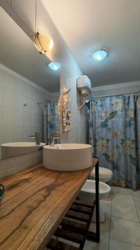 a bathroom with a tub and a sink and a toilet at La Angelica in Juana Koslay 