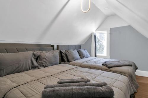 a bedroom with a large bed and a couch at Cozy Corner Buffalo Getaway in Buffalo