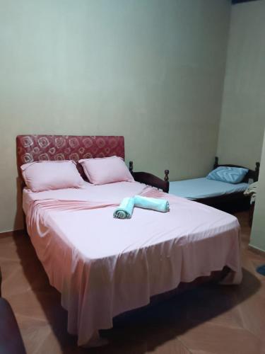 เตียงในห้องที่ Prestige Natura