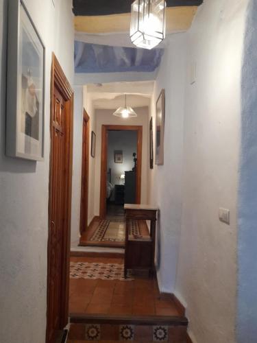a hallway of a home with a stairway and a hallway at Casa-Huerto La Juana in Trevélez