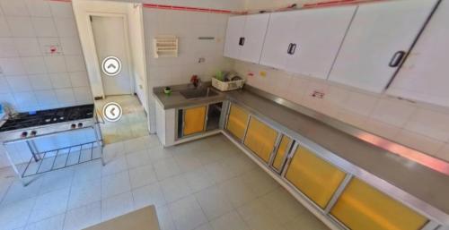 an overhead view of a kitchen with white cabinets at Villa Tahiti in Palmira