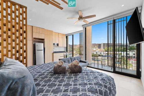 a bedroom with two teddy bears sitting on a bed at Makare Bucerias - Rooftop Pool and Steps to Beach in Bucerías