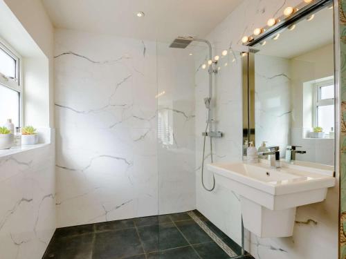 a white bathroom with a sink and a shower at 1 Bed in Hythe oc-89966 in Hythe