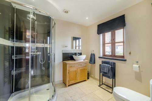 a bathroom with a shower and a sink at 5 Bed in Langport oc-h33495 in Langport