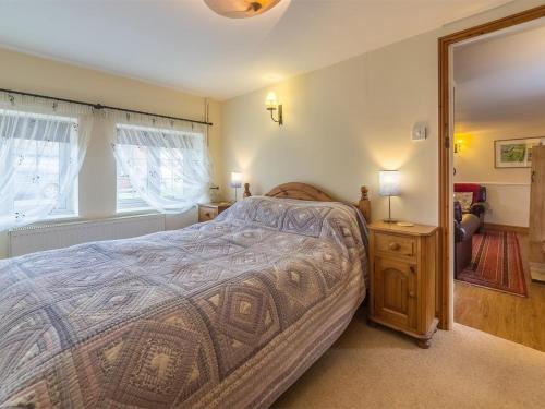 a bedroom with a large bed and a mirror at 3 Bed in Syderstone oc-kt083 in Syderstone