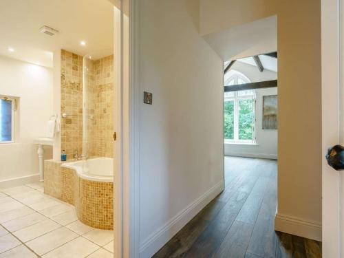 a large bathroom with a tub and a sink at 3 Bed in Richmond oc-86747 in Gilling