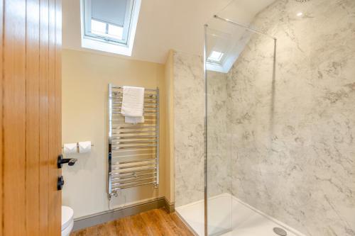 a bathroom with a shower with a glass door at 1 Bed in Pershore oc-t29051 in Pershore