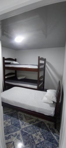 a bedroom with two bunk beds in a room at Relax in El Cerrito