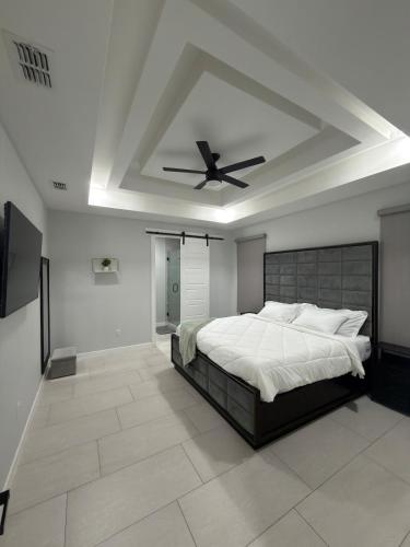 a bedroom with a bed and a ceiling fan at Rabbit Run Home in Alton