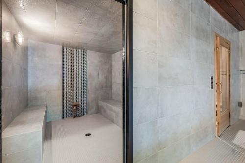 a shower with a glass door in a bathroom at Stoneridge Resort in Blanchard