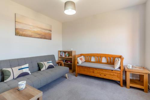a living room with a couch and a table at 3 Bed in Felixstowe oc-p29748 in Felixstowe