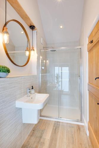 a bathroom with a sink and a shower at 2 Bed in Danby oc-wa315 in Castleton