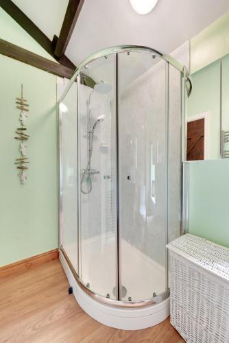 a shower with a glass enclosure in a bathroom at 2 Bed in Arkengarthdale oc-ds951 in Richmond