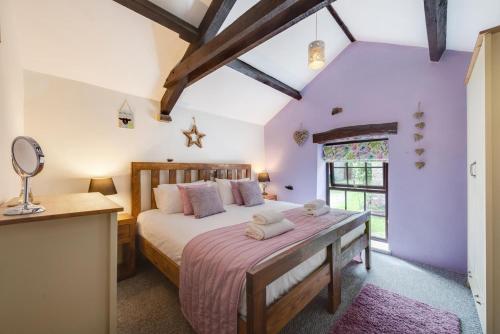 a bedroom with a large bed and a window at 2 Bed in Arkengarthdale oc-ds951 in Richmond