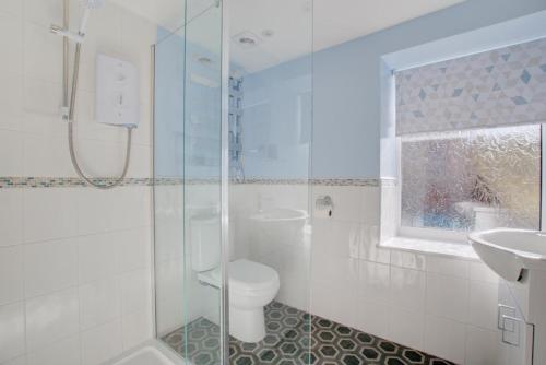 a bathroom with a shower and a toilet and a sink at 2 Bed in Gayle oc-ds912 in Hawes
