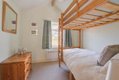 a bedroom with a bunk bed and a window at 2 Bed in Gayle oc-ds912 in Hawes