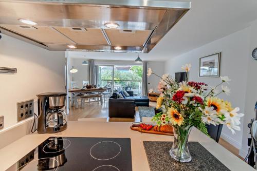 a kitchen and living room with a vase of flowers on a counter at 5 Bed in Sardis oc-m28337 in Saundersfoot