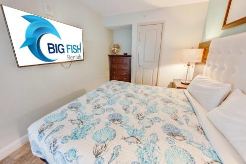 a bedroom with a bed and a sign on the wall at Romantic Honey Moon Suite, Direct Oceanfront,Pools in Myrtle Beach