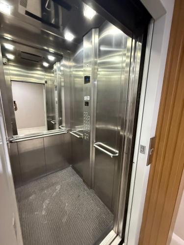 a walk in shower with a glass door at Tranquilidade e conforto proximo ao mar in Vila Velha