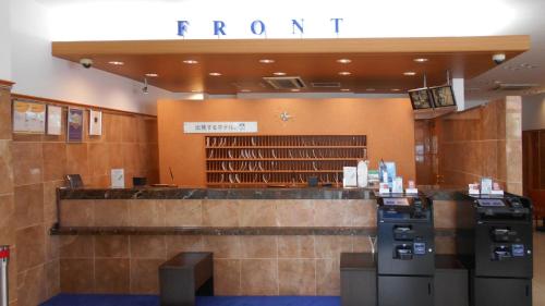 a room with a library with a ticket counter at Toyoko Inn Kokura-eki Minami-guchi in Kitakyushu