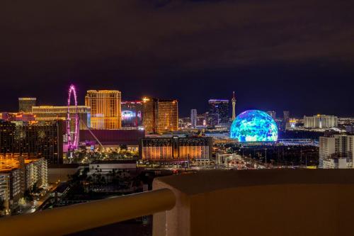 a view of a city skyline at night at SPHERE VIEW - Signature MGM Resort Lucky Gem Penthouse & Luxury Suites 27817 in Las Vegas