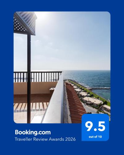 a view of the ocean from a balcony at Nabeel Homes - Penthouse Duplex with Rooftop in Alexandria