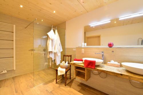 a bathroom with a sink and a mirror at Landhof Müller in Wertach