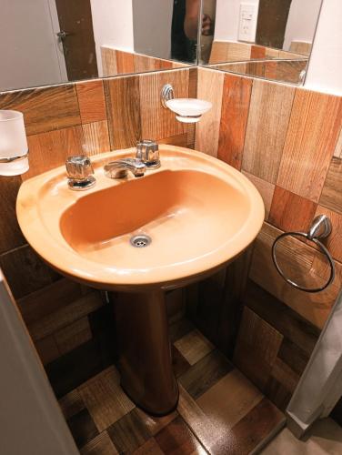 a bathroom with a sink and a mirror at Complejo Bienteveo in San Antonio de Arredondo