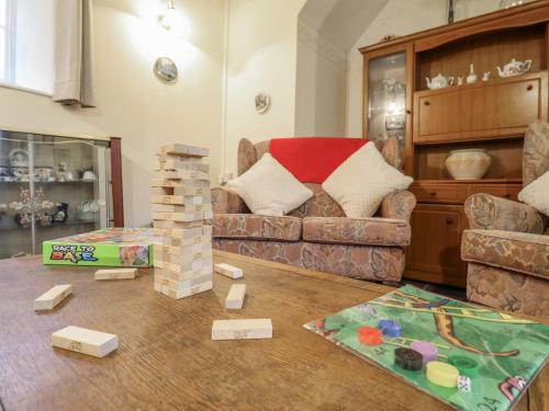 a living room with a couch and some toy bricks at Cynfal Fawr in Blaenau-Ffestiniog