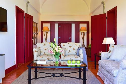 a living room with a couch and a coffee table at Pousada Convento de Beja in Beja