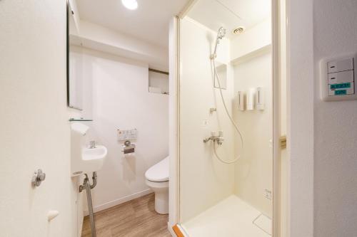 a bathroom with a shower and a toilet at Fujimi apartment601 in Tokyo