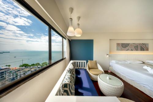 a hotel room with a view of the ocean at Jomtien Palm Beach Hotel & Resort - Family-Friendly in Jomtien Beach