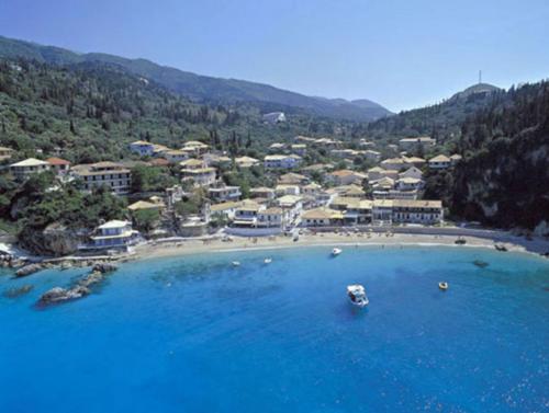 an aerial view of a beach with boats in the water at Green View Apartments in Agios Nikitas