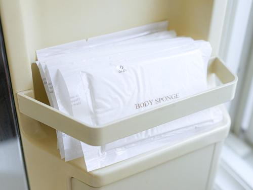 a drawer filled with white papers in a refrigerator at ROOMzero 5号室 in Hanazonomachi