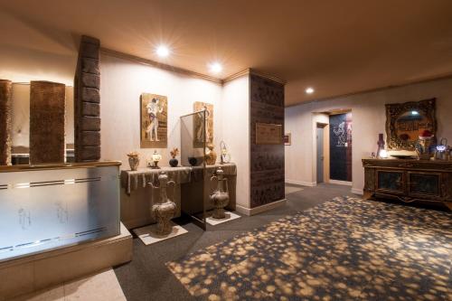a living room with a large tv and some artifacts at Hotel Pharaoh-Adult Only in Sapporo