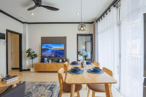 a dining room with a table and chairs at Wink City 2 Patong Center close to the Beach in Patong Beach