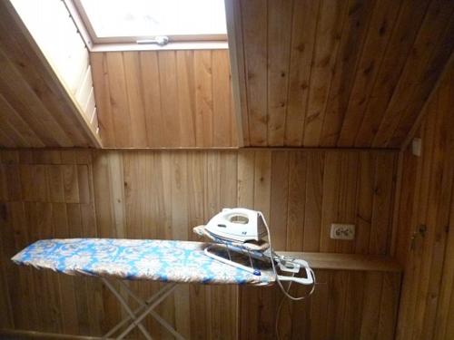 a room with a shelf in a boat with a ceiling at Home Hotel in Kamianets-Podilskyi