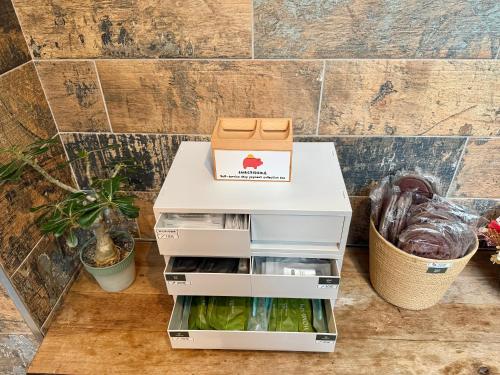 a box sitting on top of an open refrigerator at 吾庭文旅電梯民宿 WuTing Stay in Hualien City