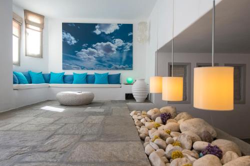 a living room with a bunch of teddy bears at Kanale's Rooms & Suites in Naousa