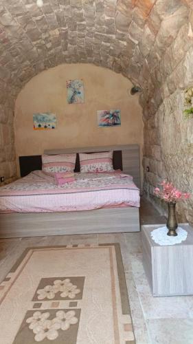 Ліжко або ліжка в номері Aal Aoudeh guesthouse
