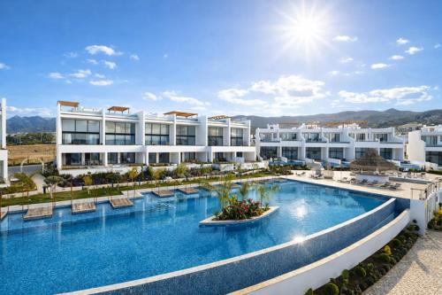 an image of a hotel with a large swimming pool at Mykonos Homes Cyprus in Kyrenia