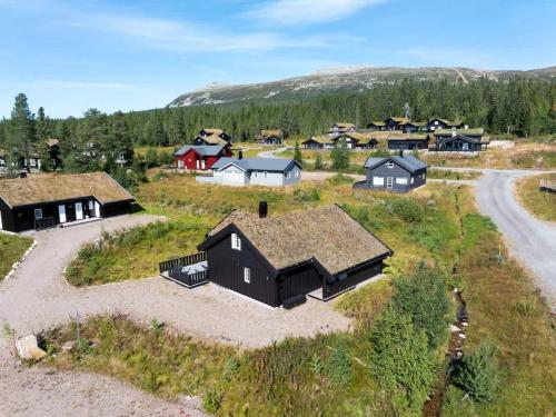 an aerial view of a village with houses and a road at Solsiden 16B by Vacation Trysil in Trysil