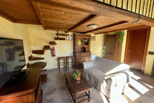 a living room with a couch and a table at La Casa di Ori in Castel SantʼElia