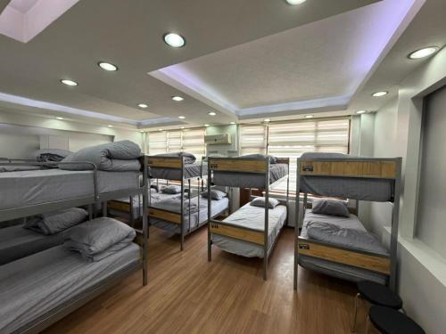 a room with a bunch of bunk beds in it at Hostelida Konya in Meram