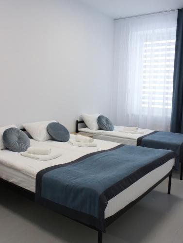 En eller flere senge i et værelse på Impuls Prof Hotel
