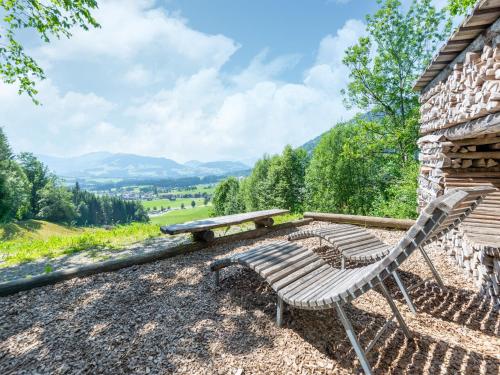 a bench and a picnic table on top of a hill at Property in Kirchbichl in Kirchbichl