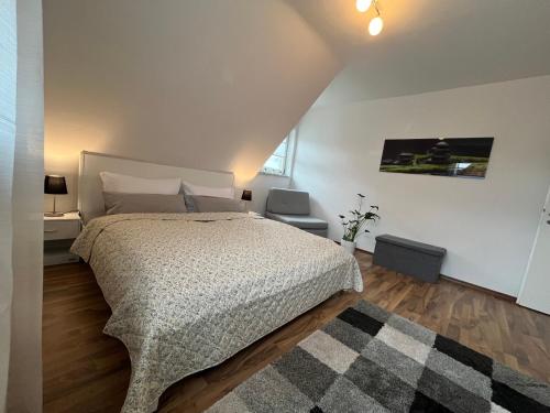 a bedroom with a large bed in a room at Ferienwohnung Balkon Grupe in Stadtoldendorf