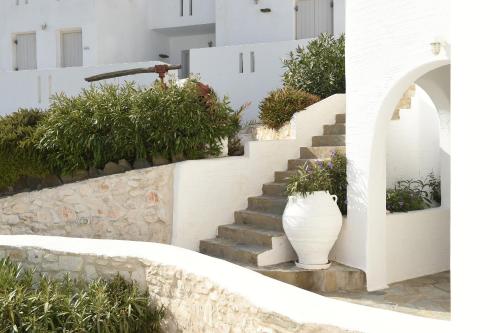 a staircase with a vase on the side of a building at Kanale's Rooms & Suites in Naousa