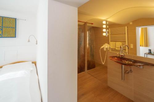 a bathroom with a shower and a sink at Altötting City Apartments in Altötting